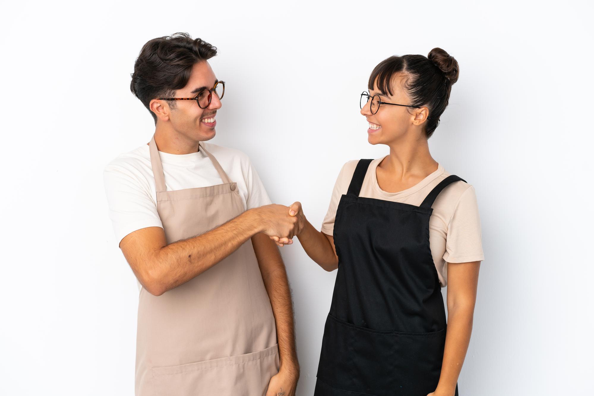 Instructor greeting participants in workshop space